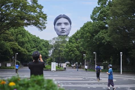 giant floating head in sky